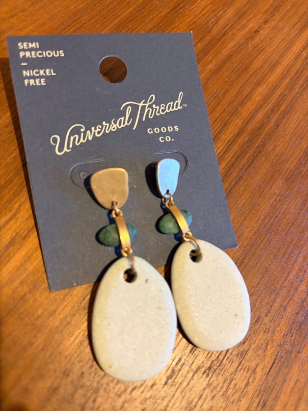 Universal Thread Cream Oval Drop Earrings with Green Bead Accents